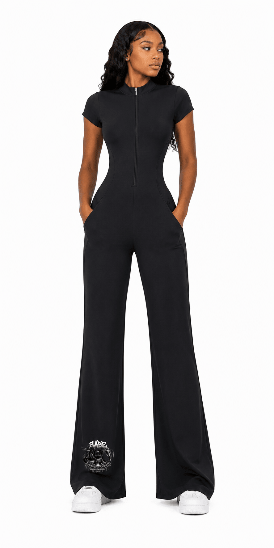 female model in a long romper dress on a white background