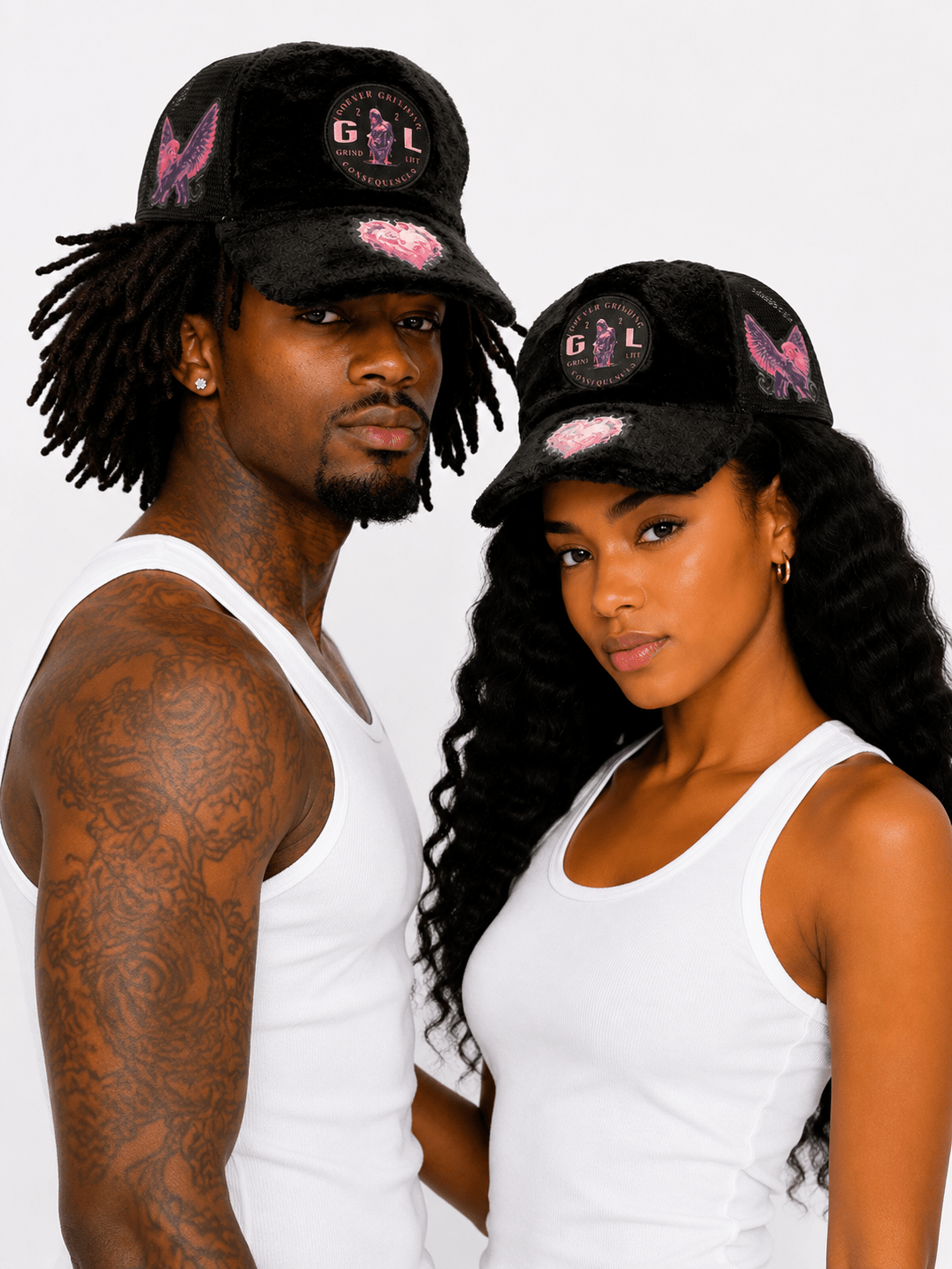 model couple with black hats on a white background