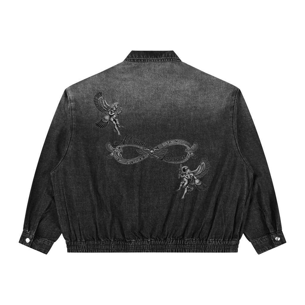 Black denim jacket with intricate designs on the back against a white background