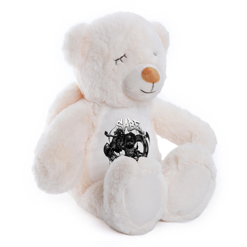 White teddy bear with a black and white design on its chest against a white background