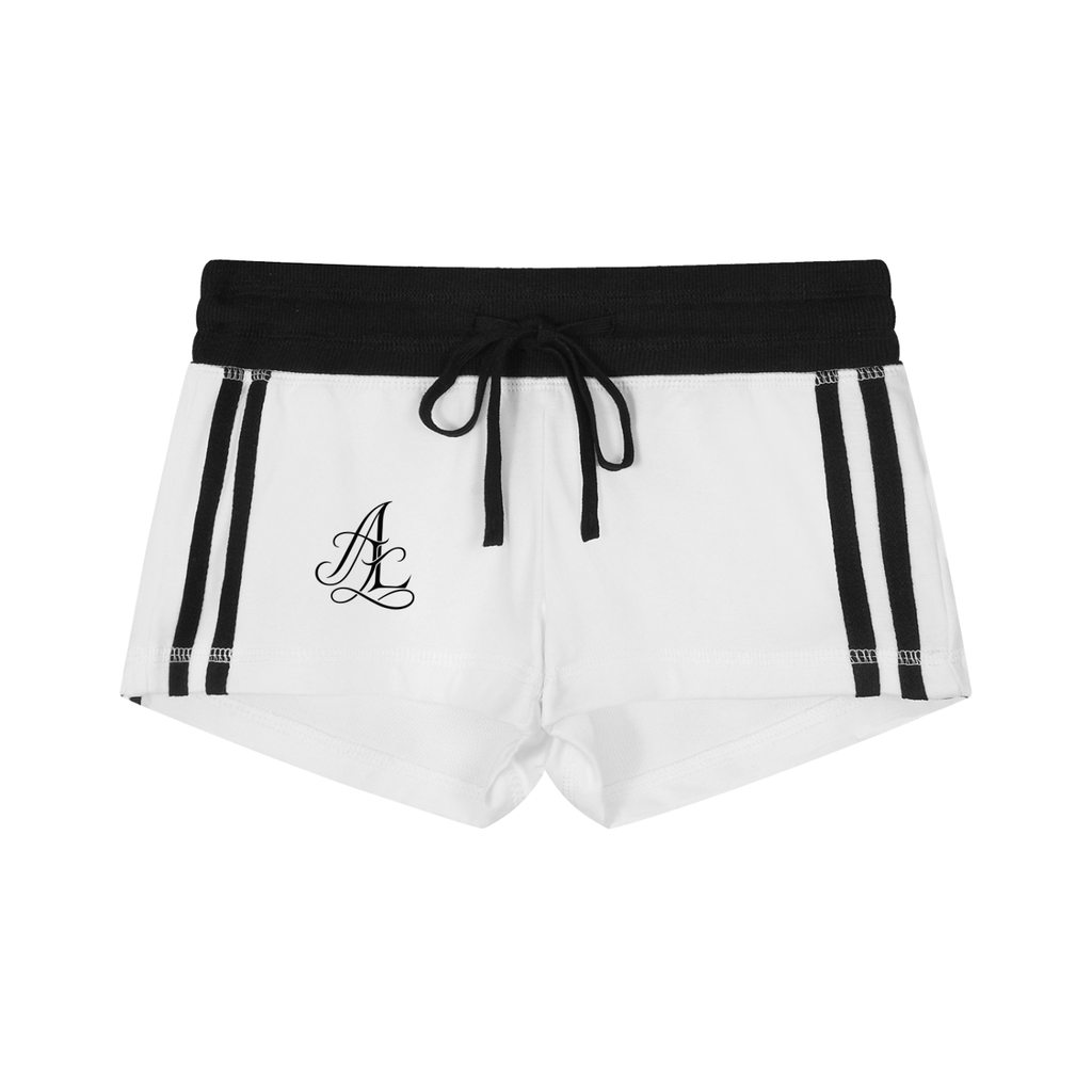 White athletic shorts with a black elastic waistband, black drawstring, black side stripes, and a black monogram logo on the left leg.