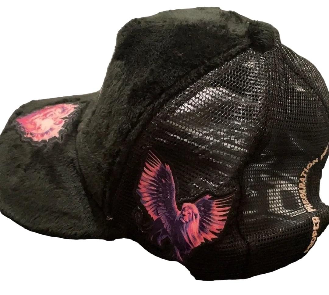 Black cap with pink eagle design on a white background
