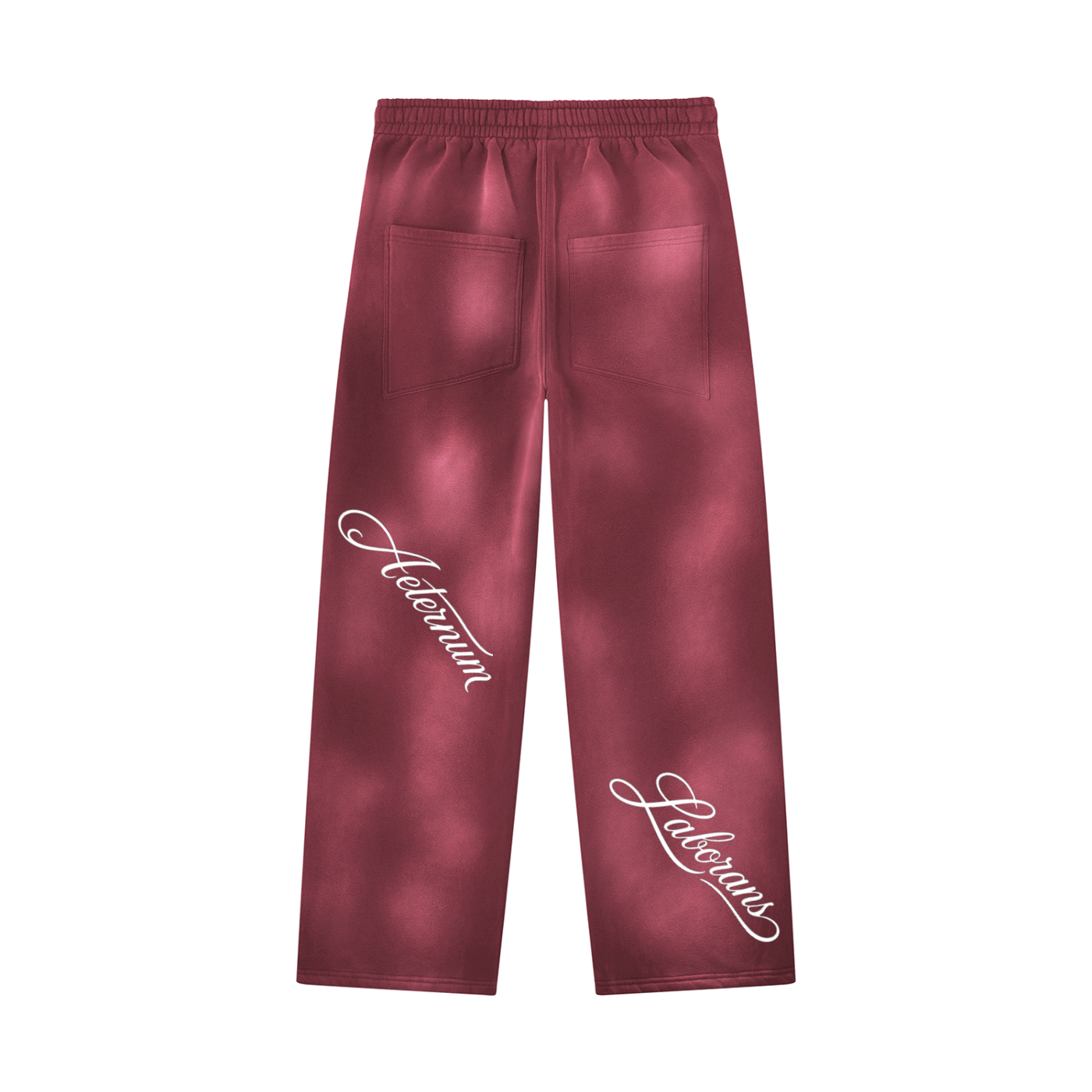 A pair of dark red sweatpants with a tie-dye pattern, featuring white script text on both legs and two back pockets, shown against a plain white background.