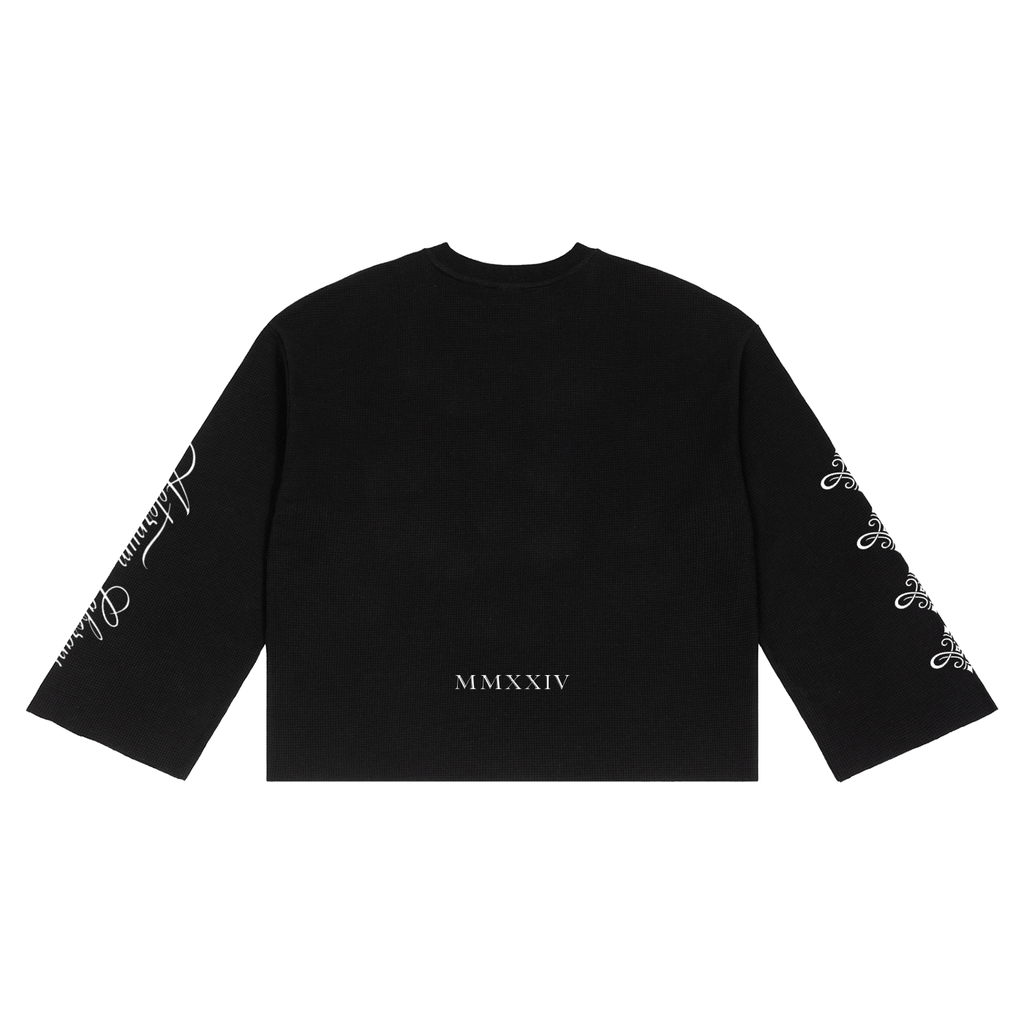 A black long-sleeve crop top sweatshirt with white graphic text and script designs on both sleeves, and 'MMXXIV' printed in white near the hem, shown flat on a white background.