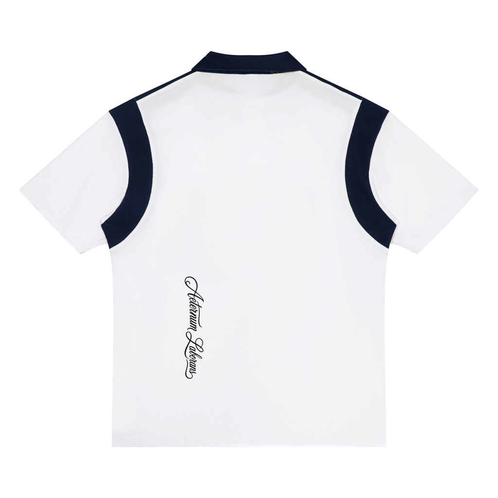 White short-sleeve polo shirt with dark navy blue contrast trim along the collar, shoulders, and sleeves, featuring a vertical black script logo on the lower back.