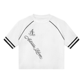 A white short-sleeve crop top with black contrast stitching along the raglan sleeves, featuring a black script 'Aderma Labanyi' logo on the left chest and black stripes on the sleeve cuffs, shown against a plain white background.