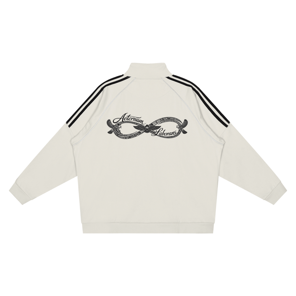 An off-white track jacket shown from the back, featuring black double stripes on the shoulders and a black graphic print in the center with the words 'Asterism Deva'.