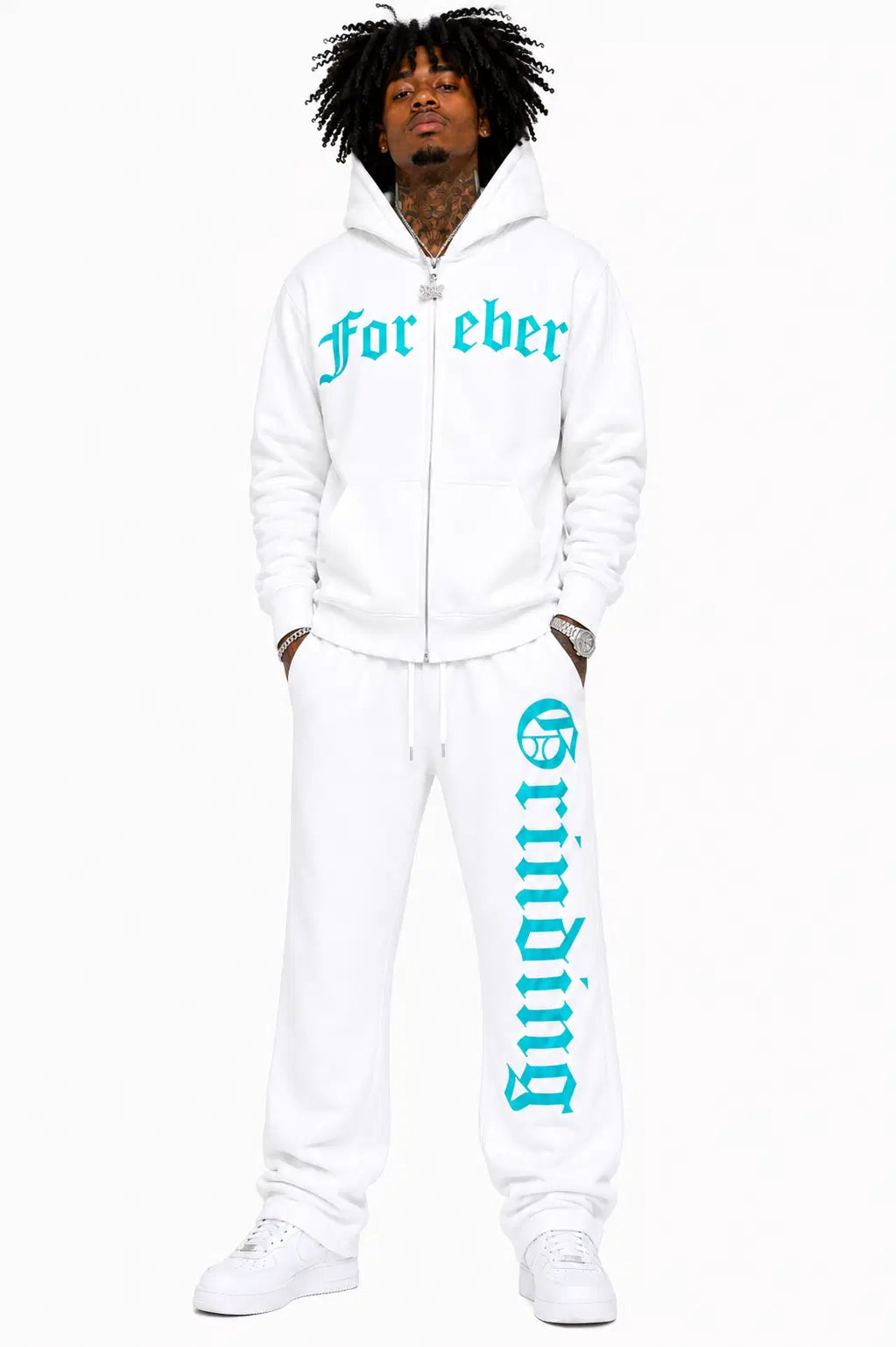 Person wearing a white hoodie and pants with turquoise text on a white background