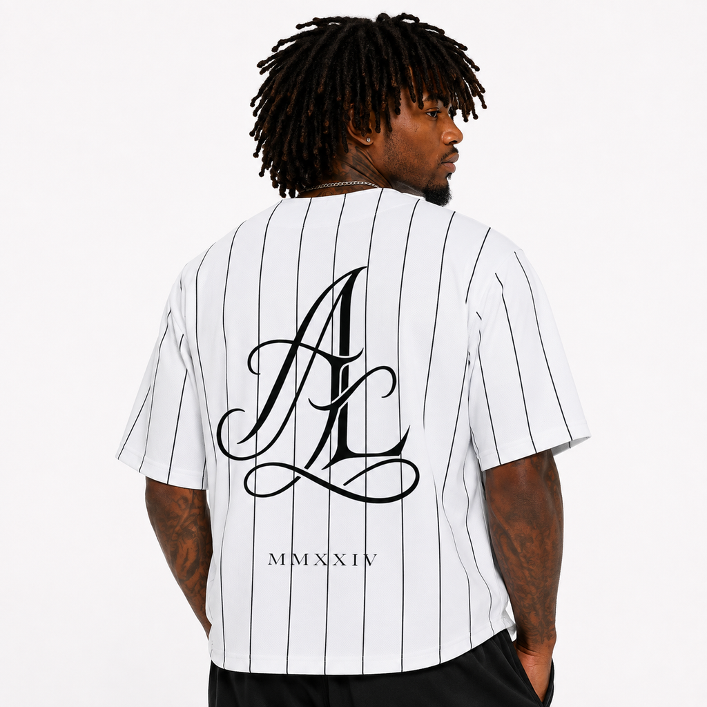 A man shown from the back wearing a white short-sleeve pinstripe shirt with a large black cursive 'AL' graphic and 'MMXIV' text on the back, photographed against a plain light background.
