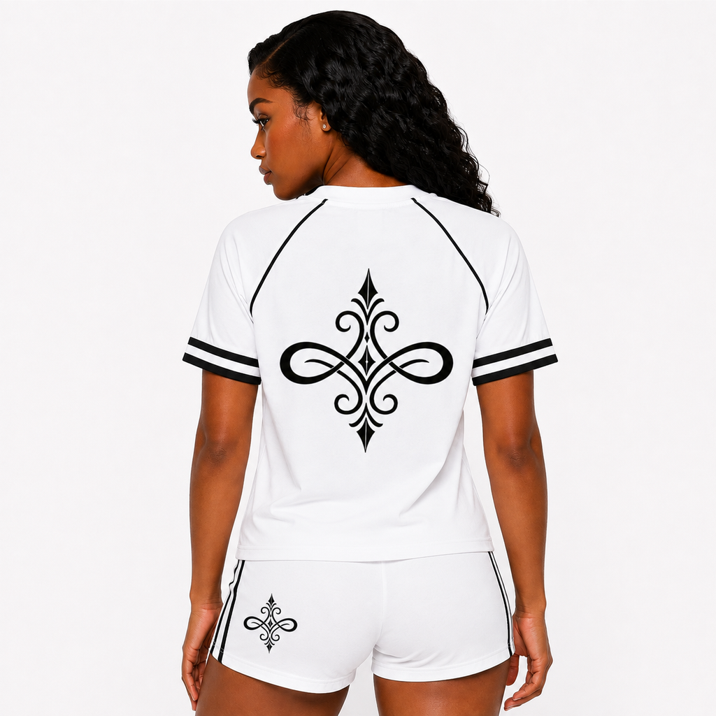 A woman shown from the back wearing a white short-sleeve athletic jersey and matching shorts. The jersey has black trim along the shoulders and sleeve cuffs, with a large black ornamental symbol printed across the back.