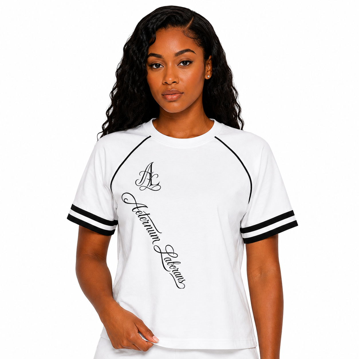 A woman modeling a white short-sleeve t-shirt with black double stripes on the sleeves and black script text reading 'Autumn Leaves' on the front.