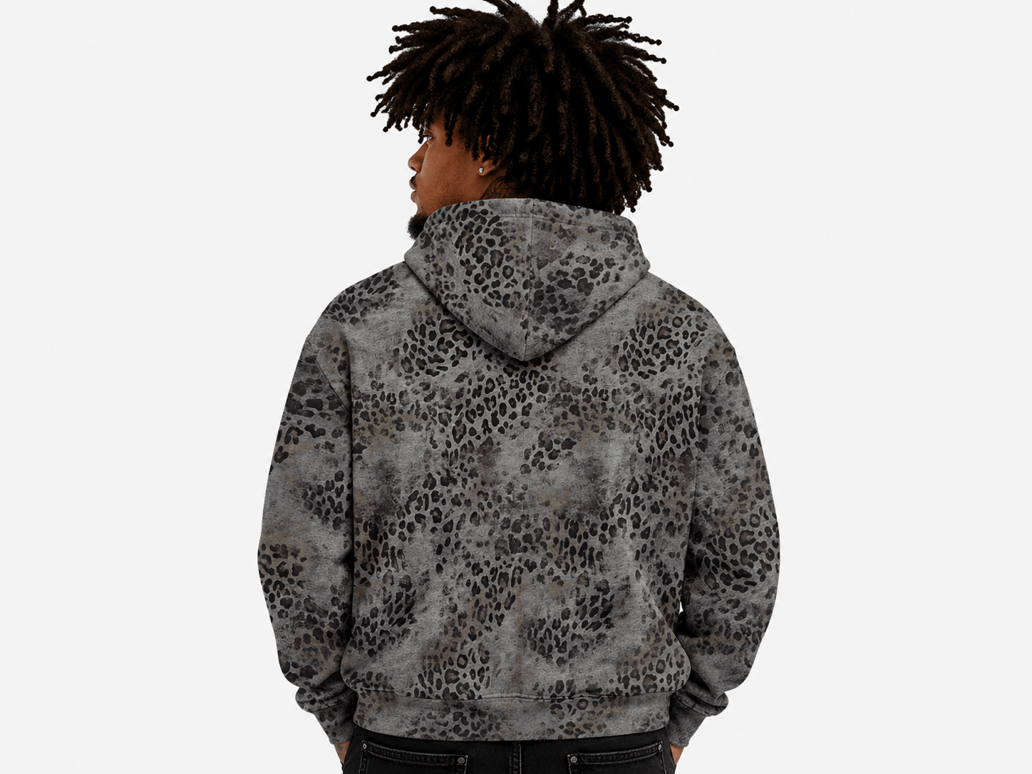 A person shown from the back wearing a gray and black leopard-print hoodie against a plain light gray background.
