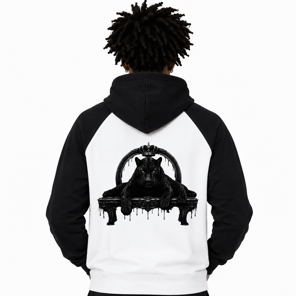 Person wearing a black and white hoodie with a graphic design on the back