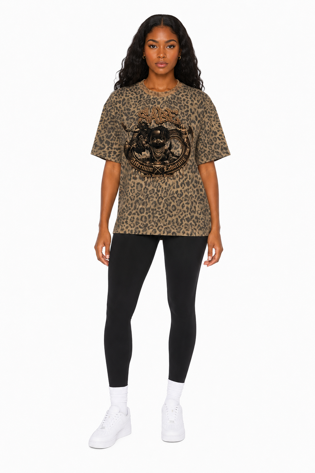 Woman wearing a leopard print t-shirt and black leggings on a white background