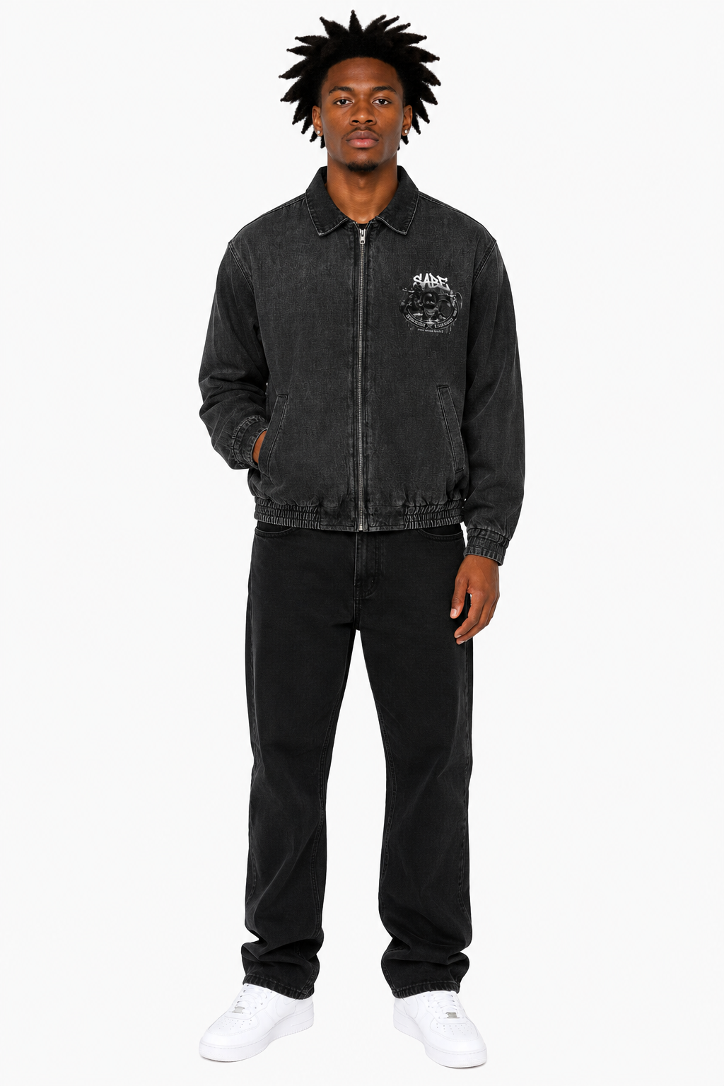 Man wearing a black jacket and pants on a white background