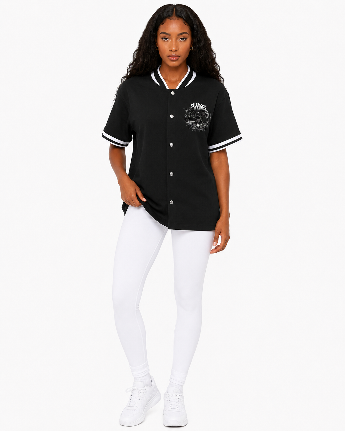 Person wearing a black baseball jersey with white accents on a white background