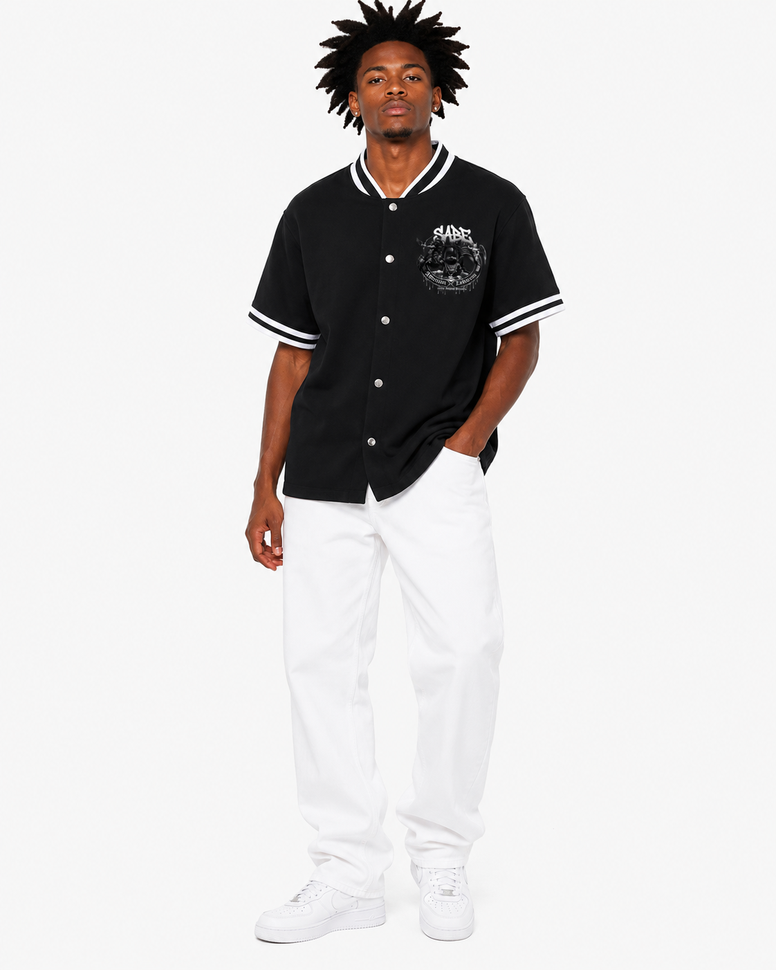 Person wearing a black baseball jersey with white accents on a white background