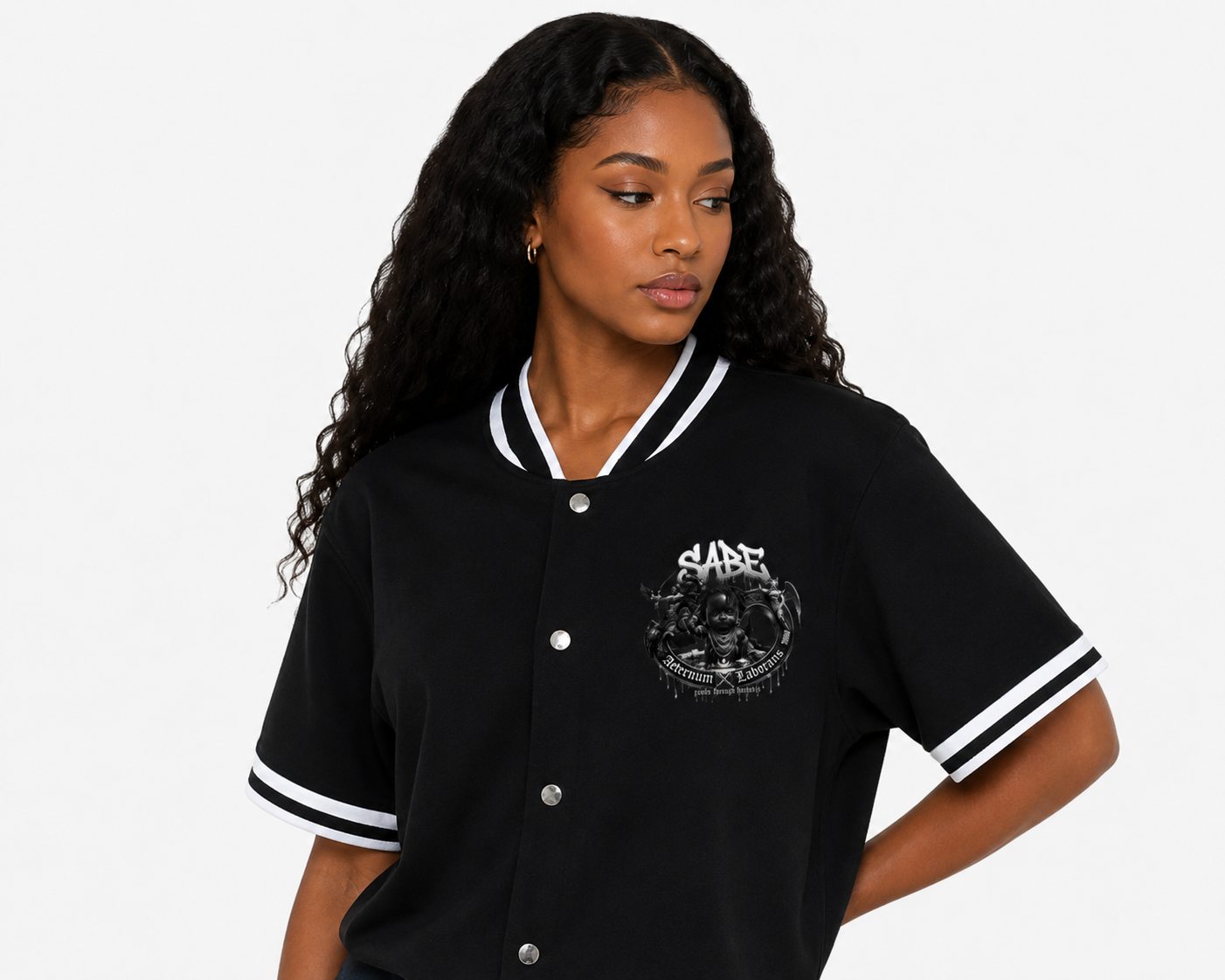 Woman wearing a black varsity jacket with a logo on a white background