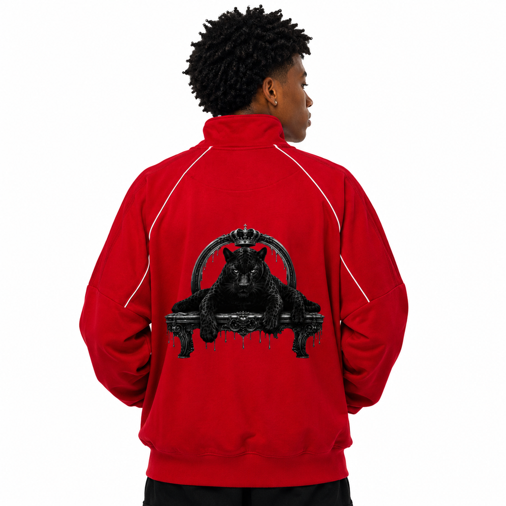 Person wearing a red jacket with a black panther design on the back, on a white background