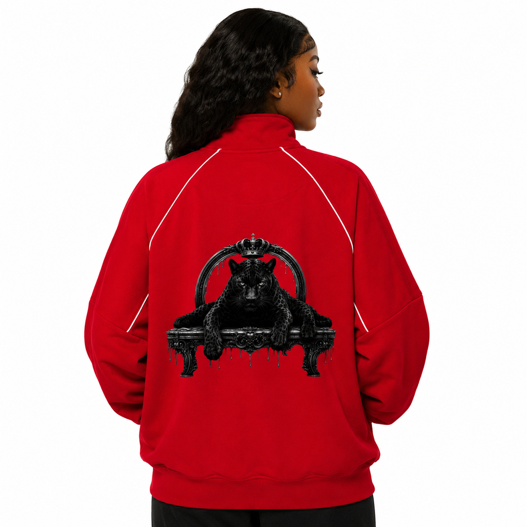 Person wearing a red jacket with a black panther design on the back, on a white background