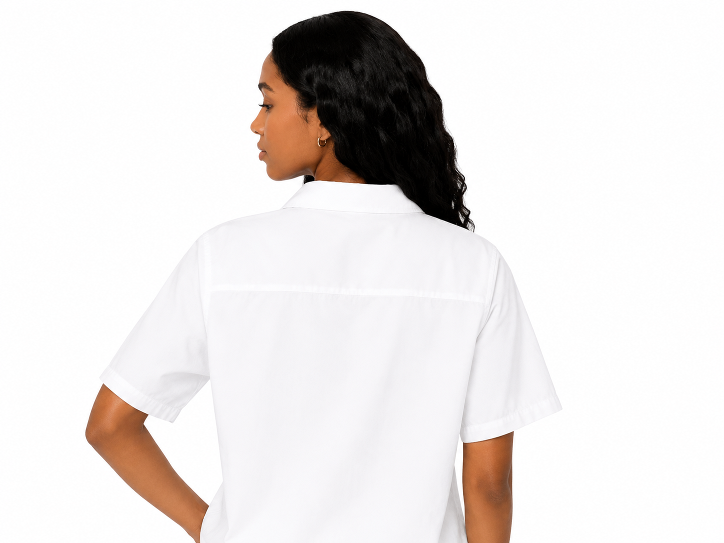 Person wearing a white polo shirt on a white background