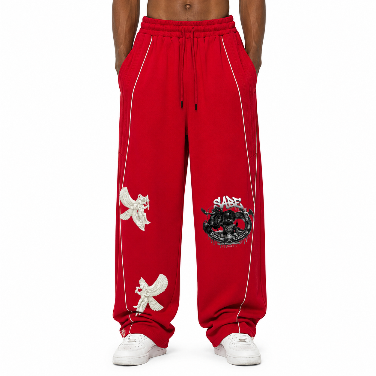 Red sweatpants with white accents and graphics on a white background