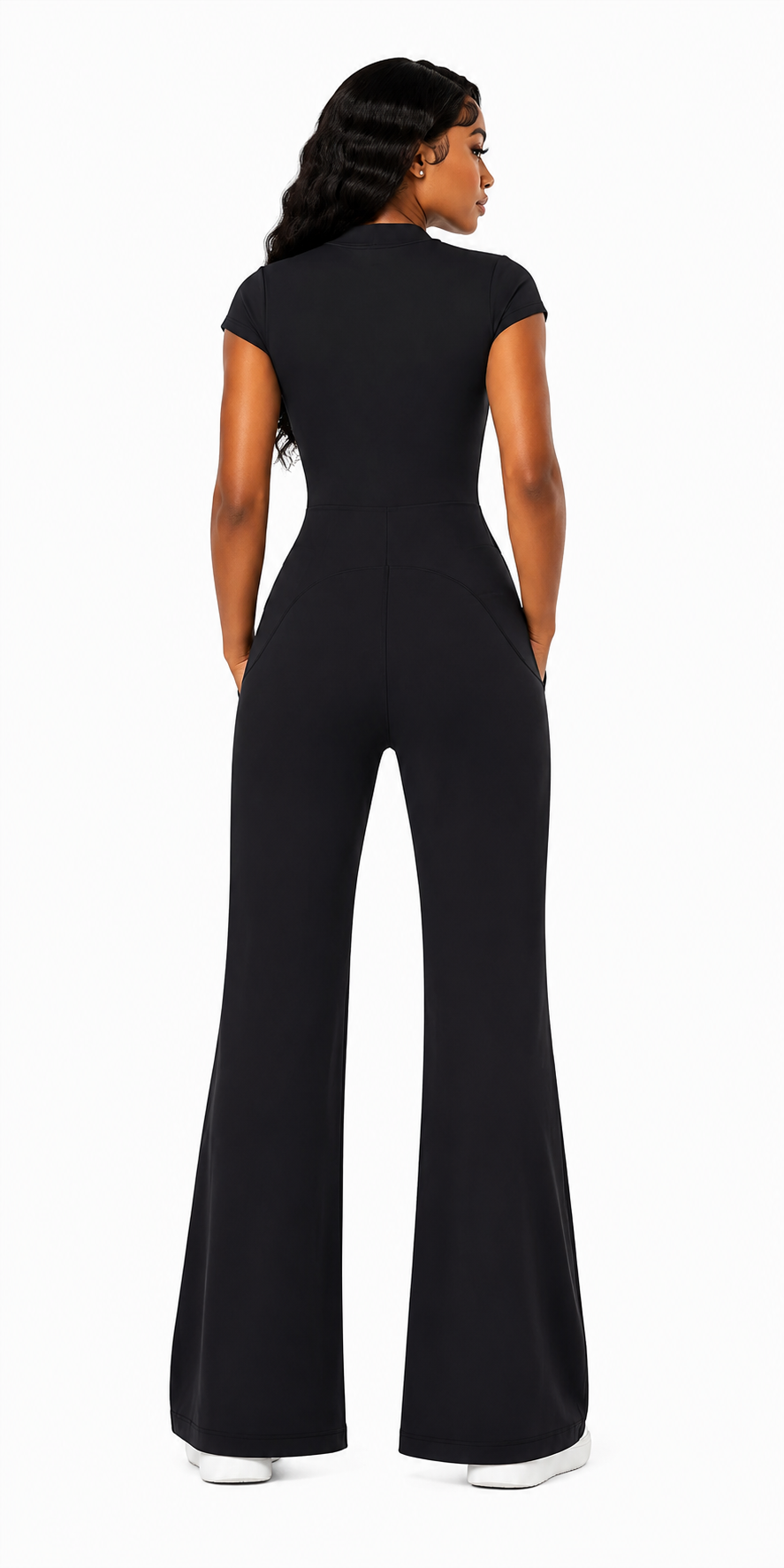 Person wearing a black jumpsuit on a white background