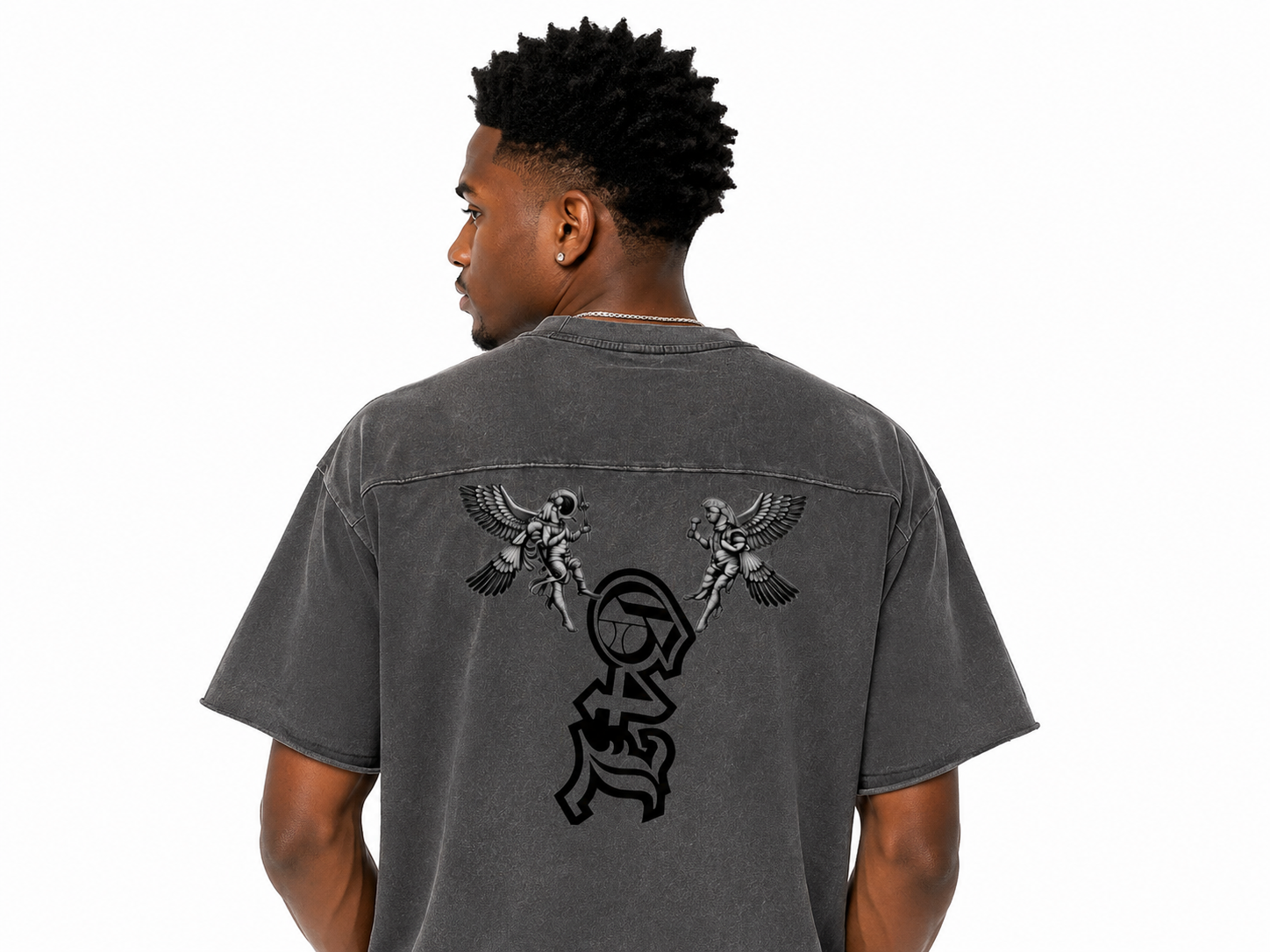 Person wearing a gray t-shirt with a design on the back, standing against a white background