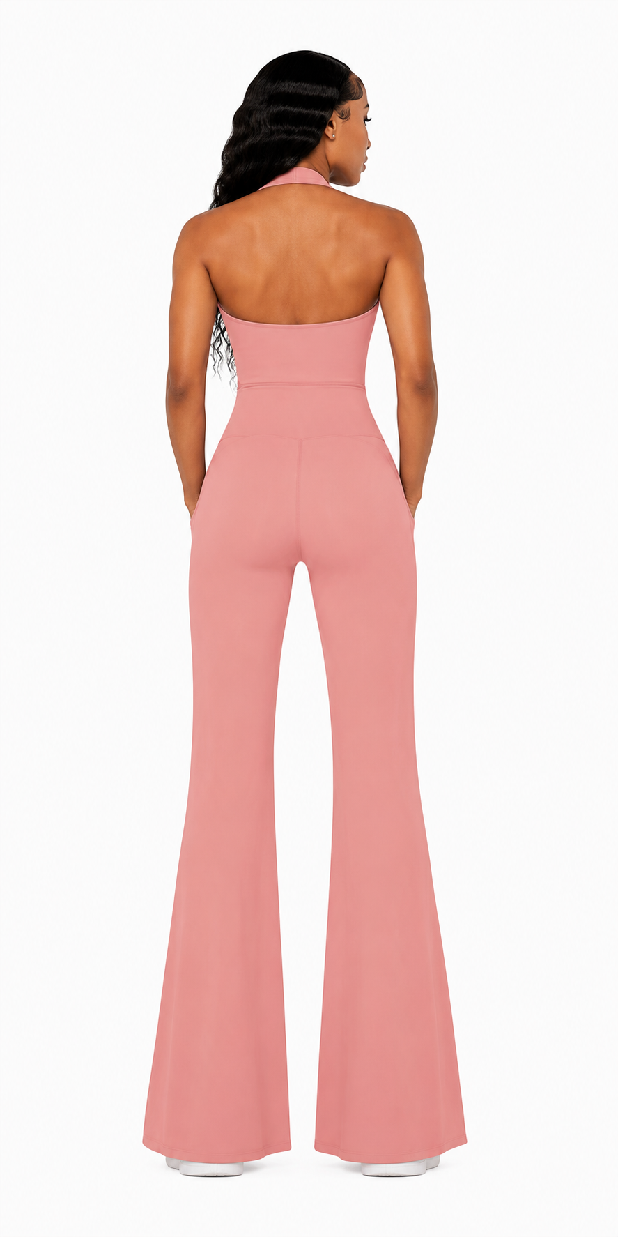 Pink jumpsuit worn by a model on a white background