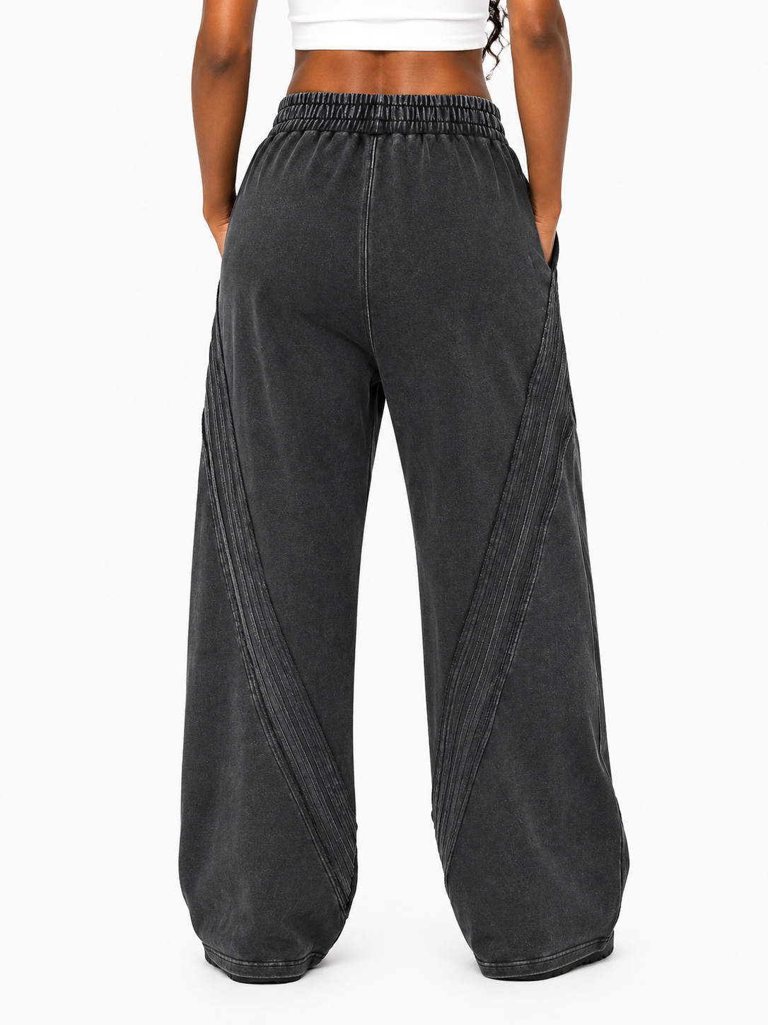 Black wide-leg pants worn by a person on a white background