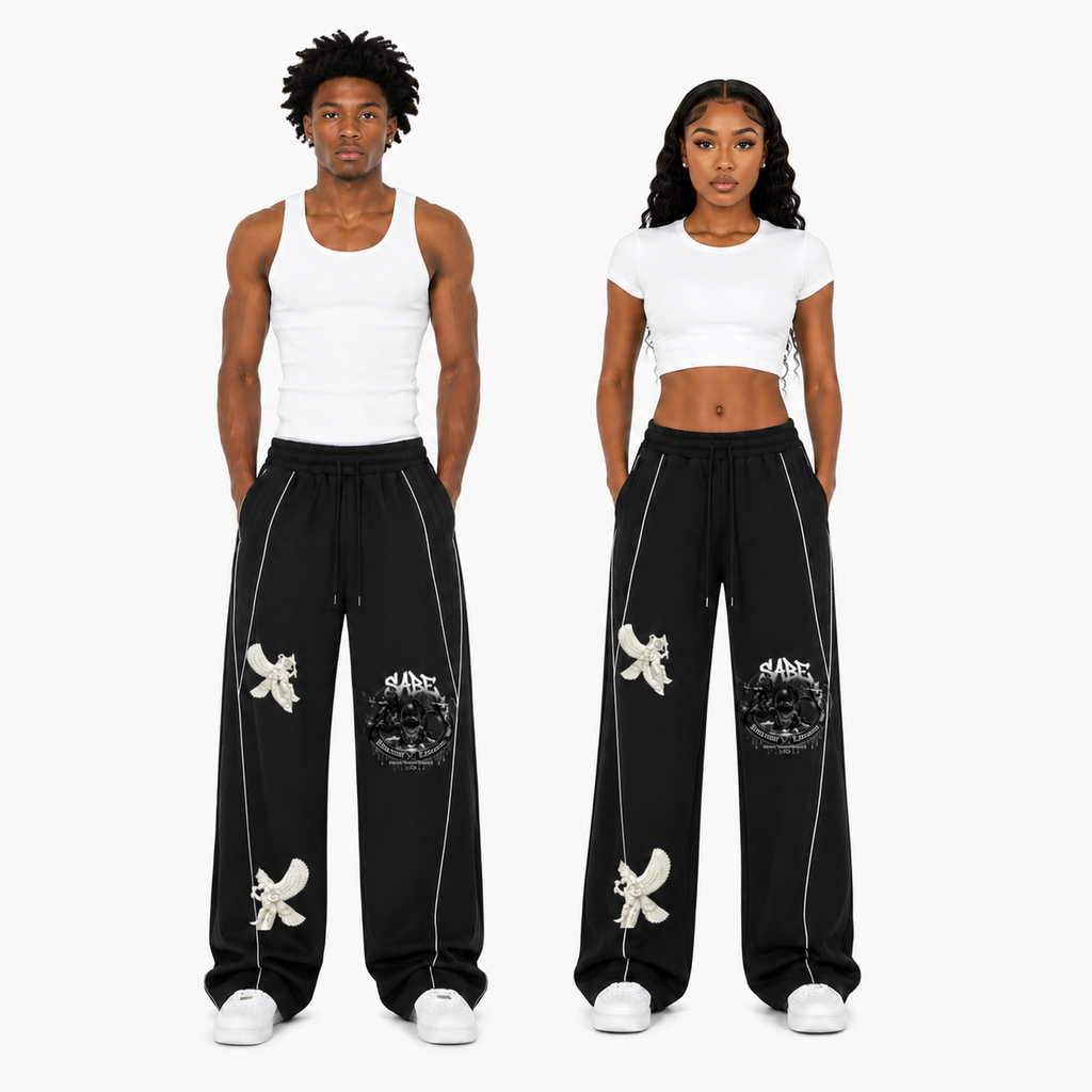 Two people wearing black pants with white designs on a white background