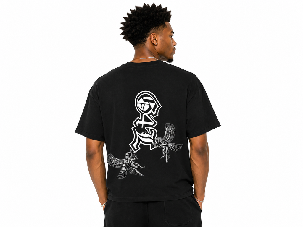 Person wearing a black t-shirt with white graphic design on the back, standing against a white background