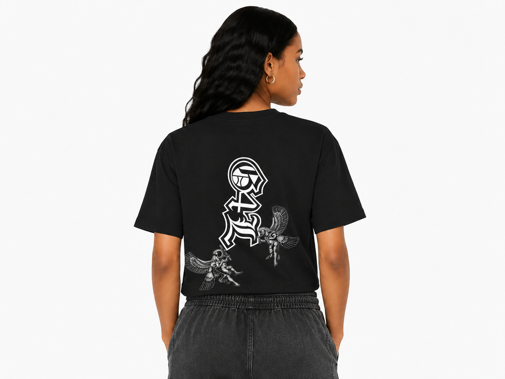Person wearing a black t-shirt with white graphics on the back, standing against a white background