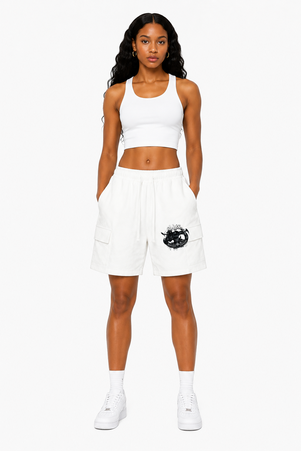 Woman wearing a white sports bra and shorts with a logo on a white background