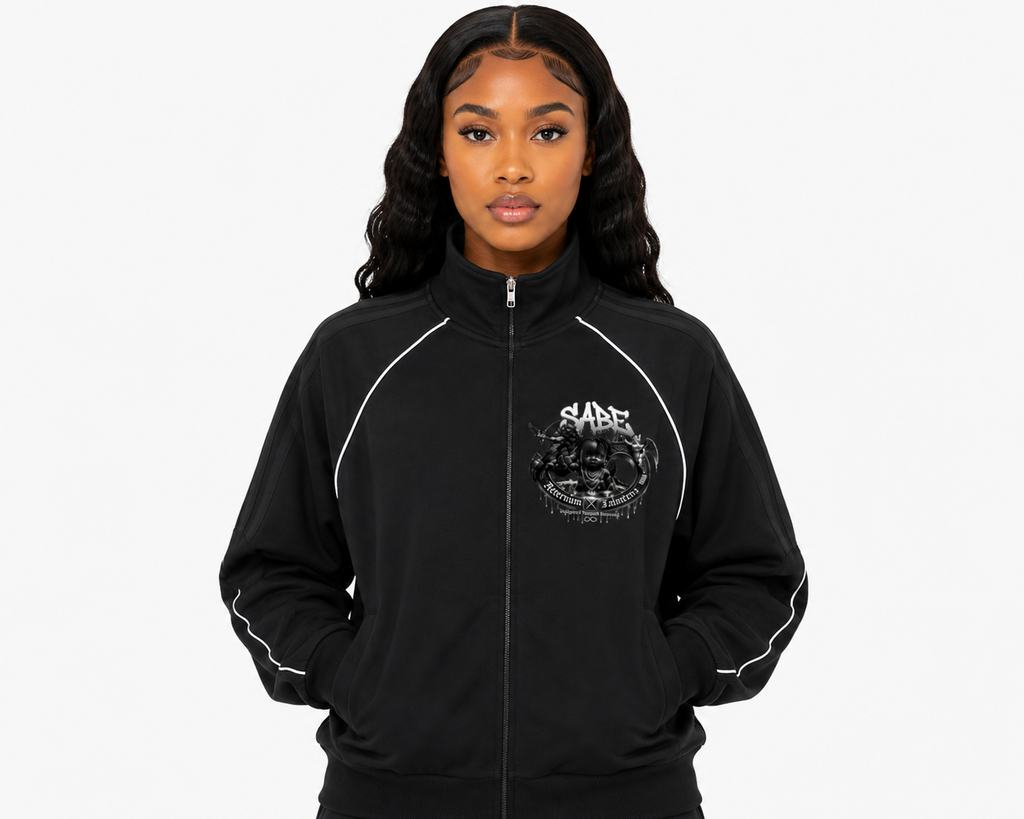 Person wearing a black jacket with a logo on a white background