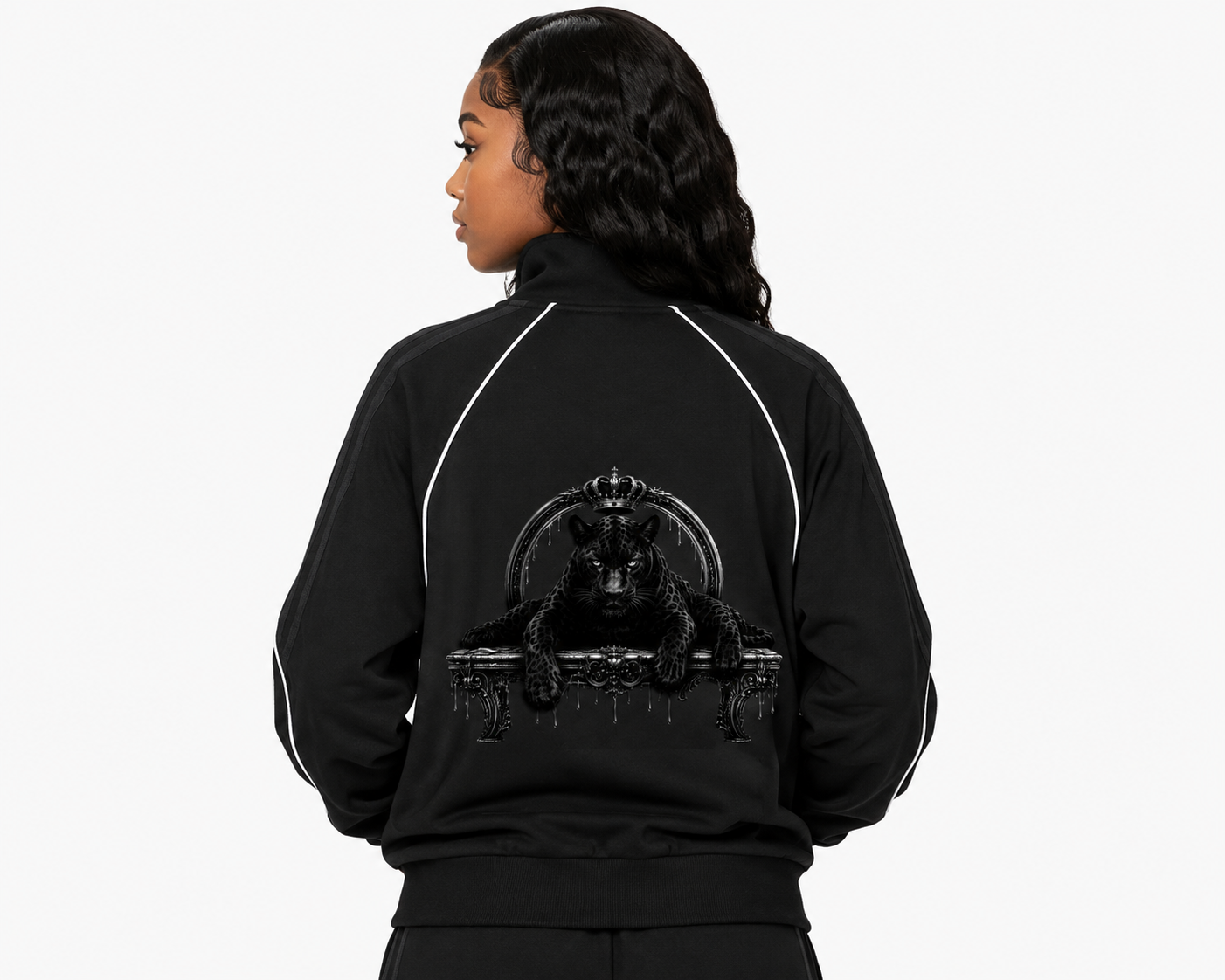 Person wearing a black jacket with a bear graphic on the back against a white background