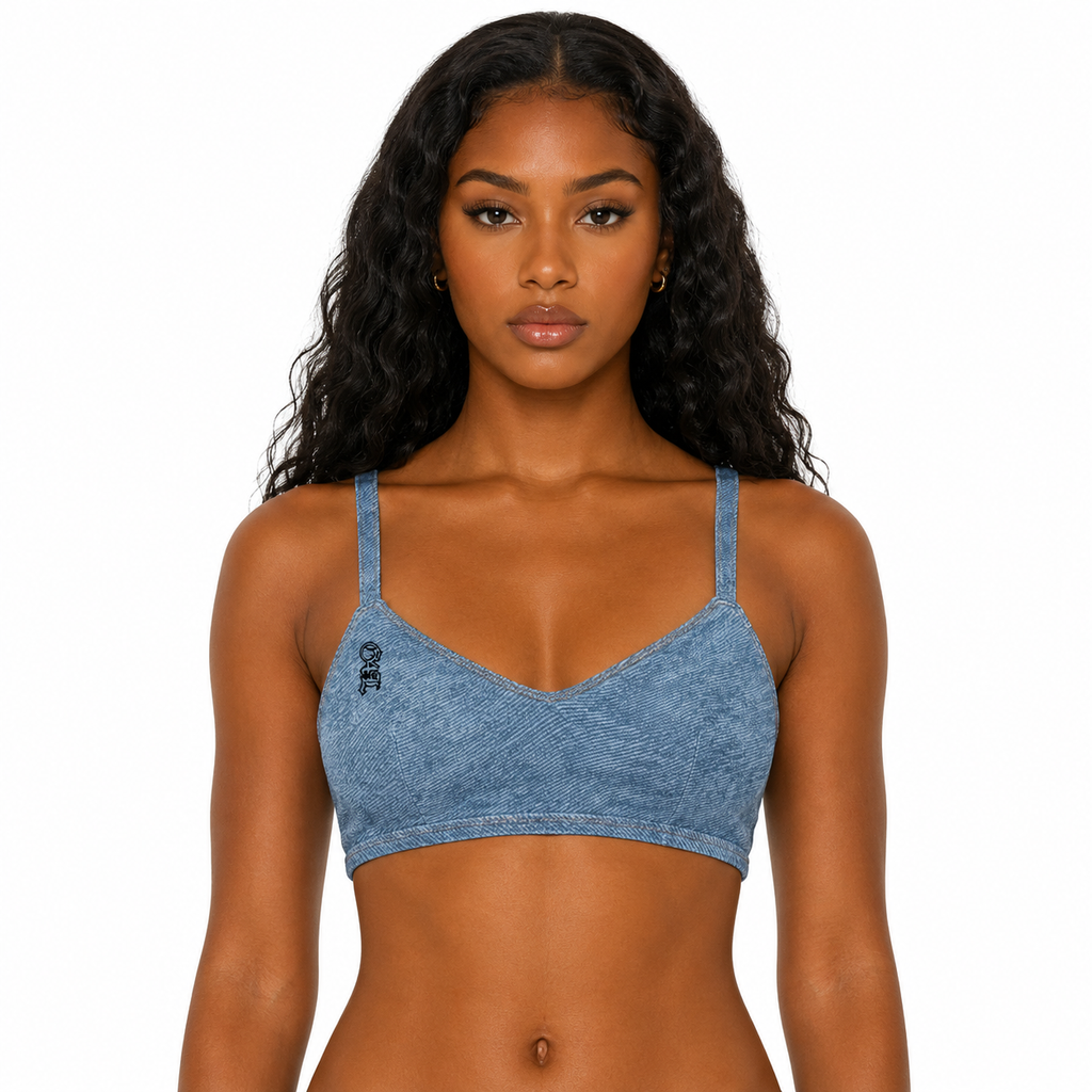 Woman wearing a blue denim-style sports bra on a white background