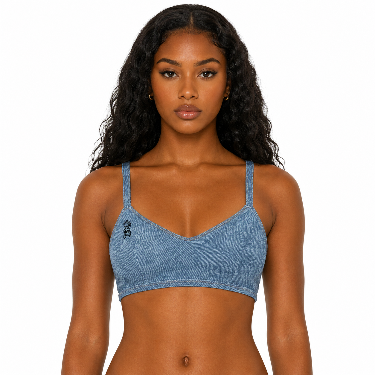 Woman wearing a blue denim-style sports bra on a white background