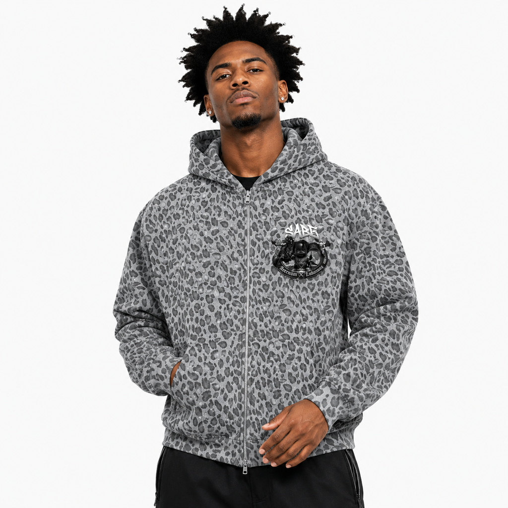 Man wearing a gray leopard print hoodie with a logo on a white background