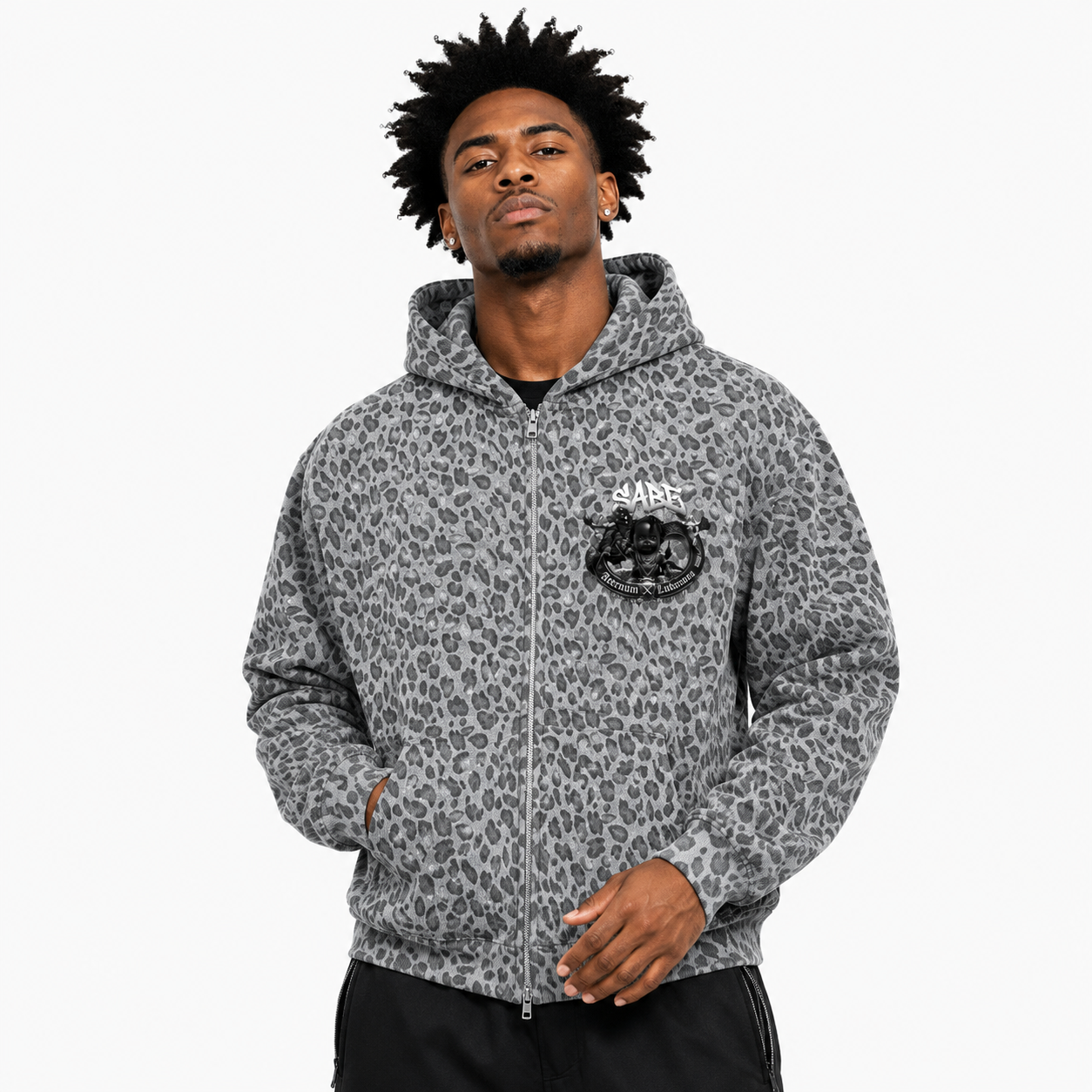 Man wearing a gray leopard print hoodie with a logo on a white background