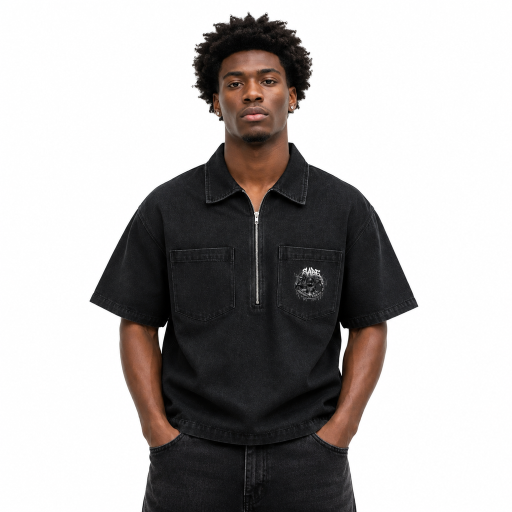 Man wearing a black short-sleeve shirt with a logo on a white background