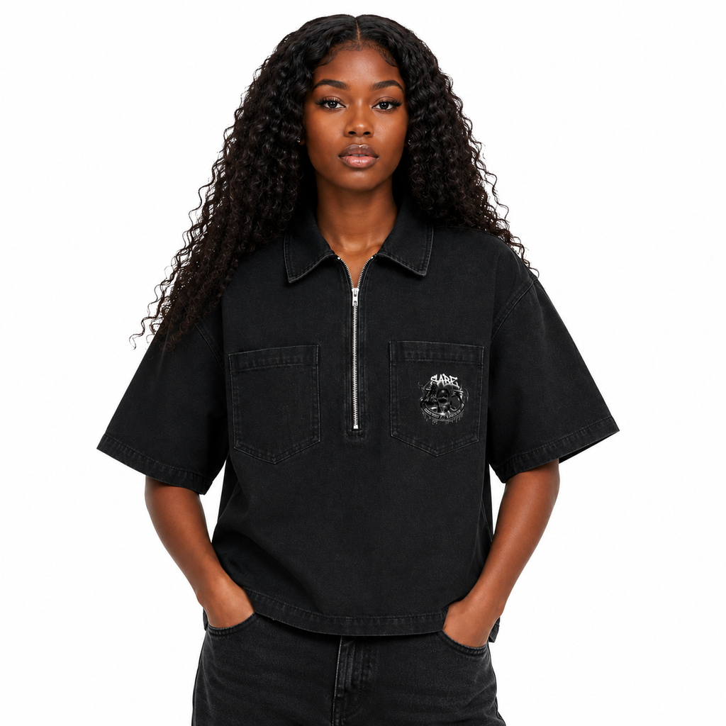 Woman wearing a black short-sleeve shirt with a logo on a white background