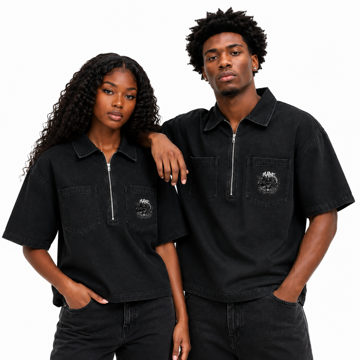 Two people wearing matching black shirts with a logo on a white background
