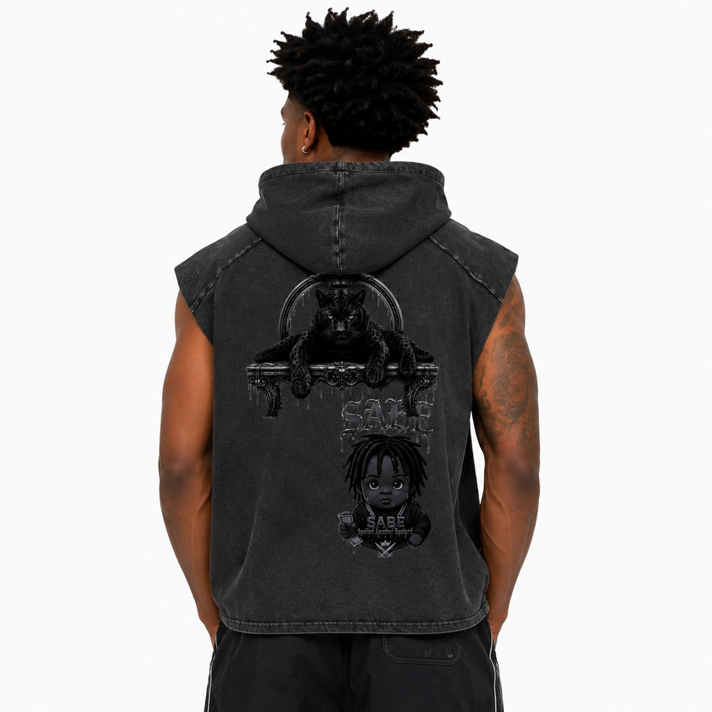 Person wearing a black sleeveless hoodie with graphic designs on the back against a white background