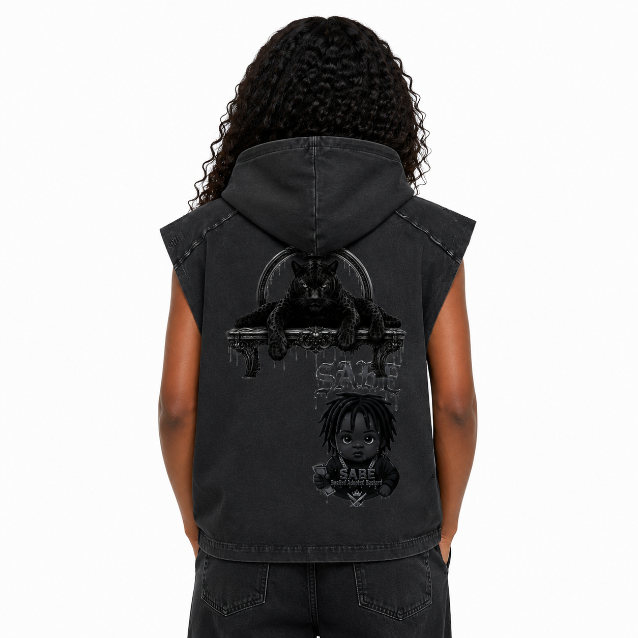 Black sleeveless hoodie with graphic designs on the back, worn by a person.