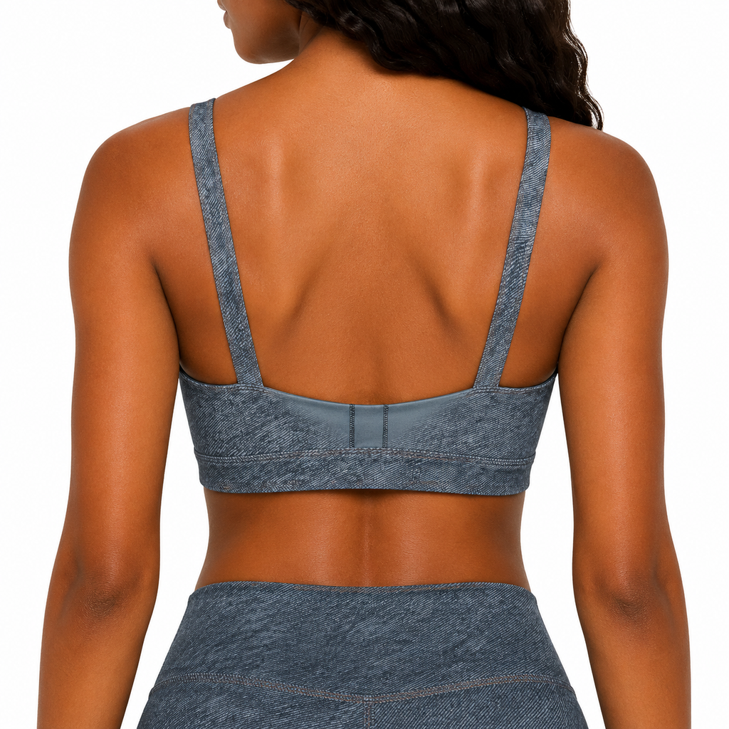 Person wearing a blue sports bra and leggings set on a white background