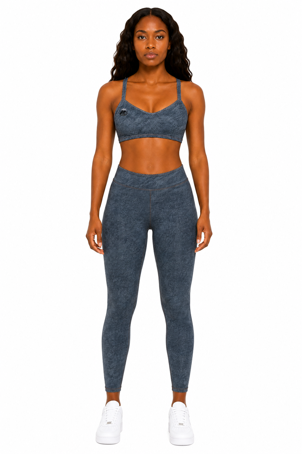 Woman wearing a blue athletic outfit on a white background