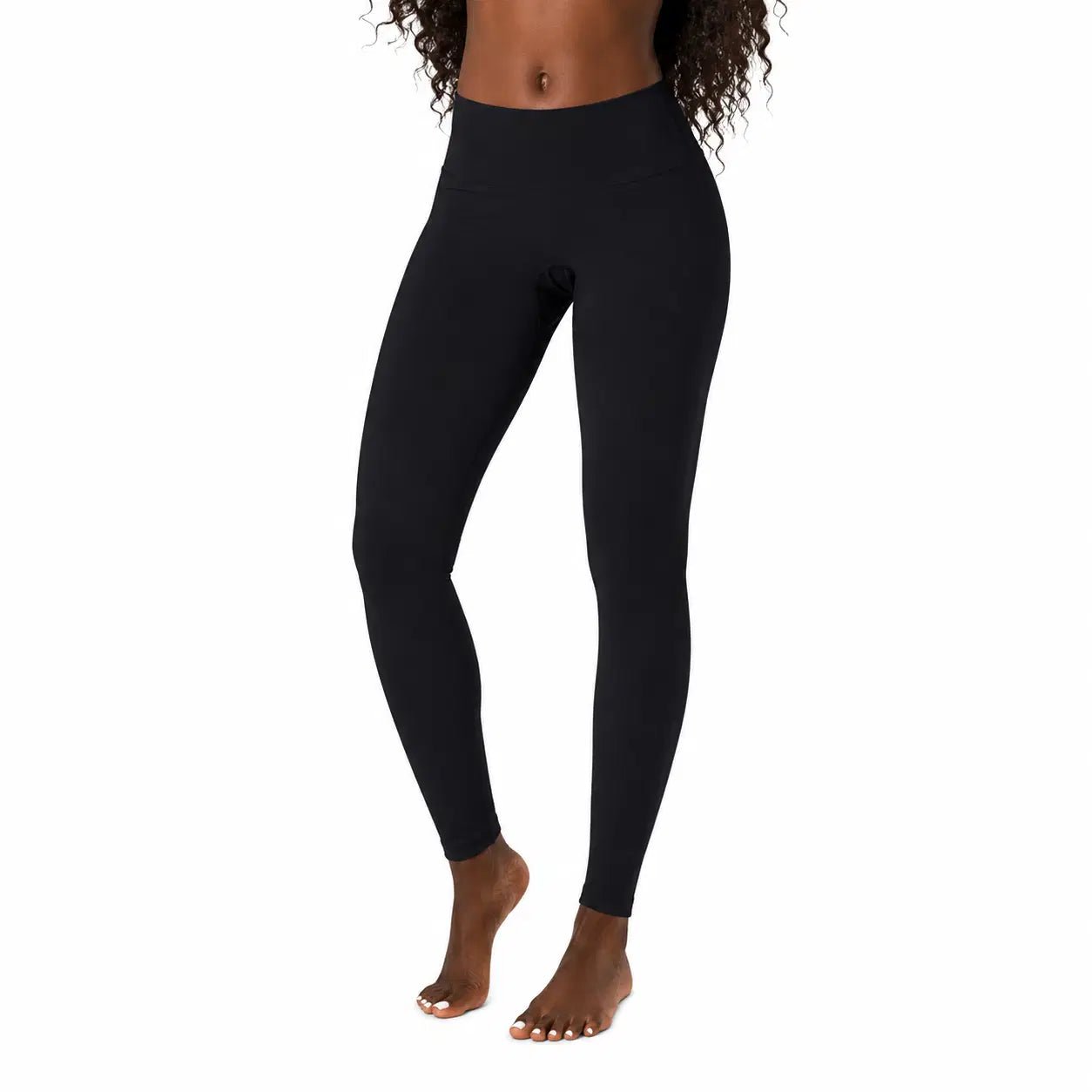 Black leggings worn by a person on a white background