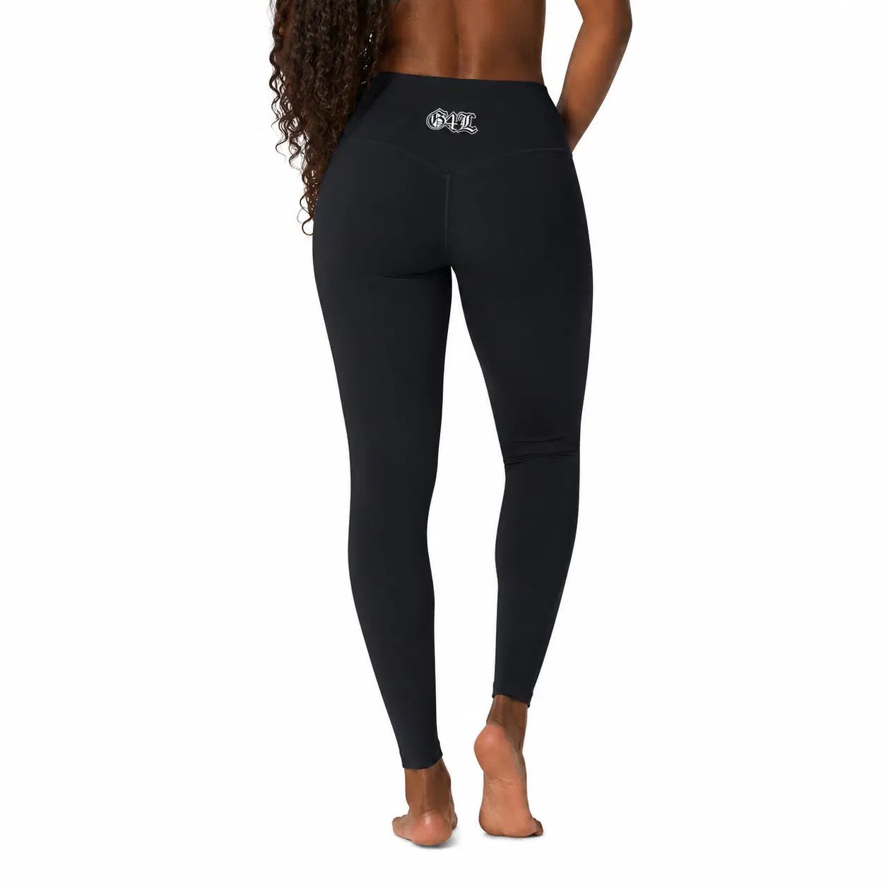 Black leggings with a brand logo on the back pocket against a white background