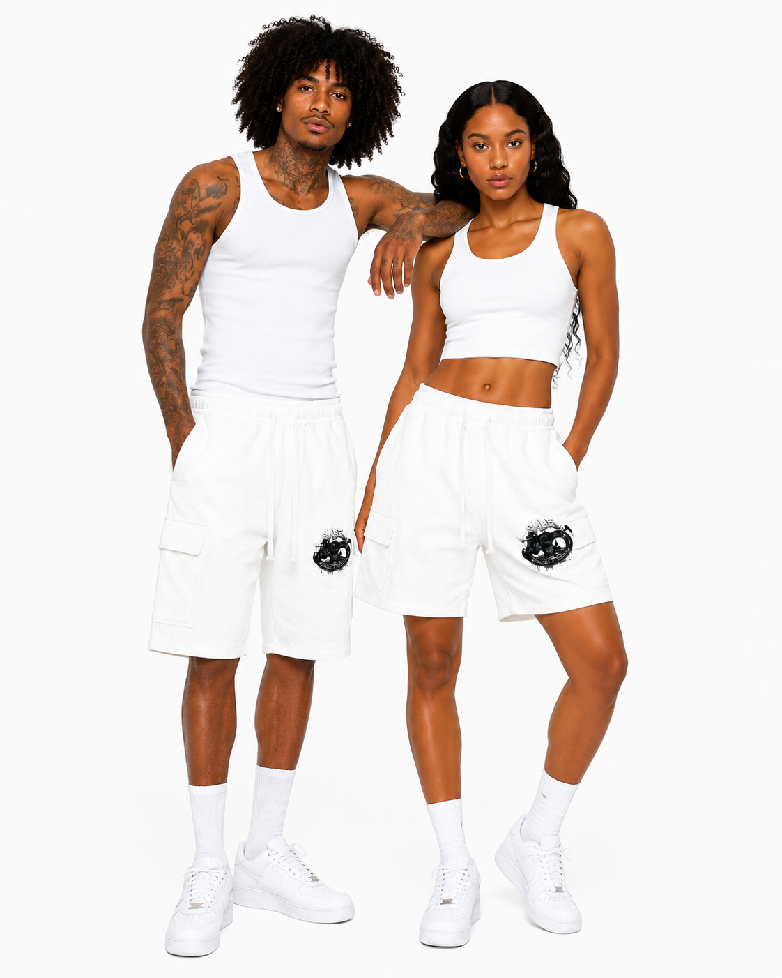 Two people wearing matching white athletic outfits on a white background